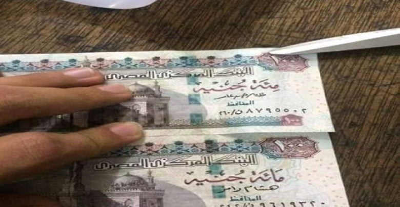 يلا خبر | النشطاء يتداولون خطأ في عملة الـ100 جنيه «صور»